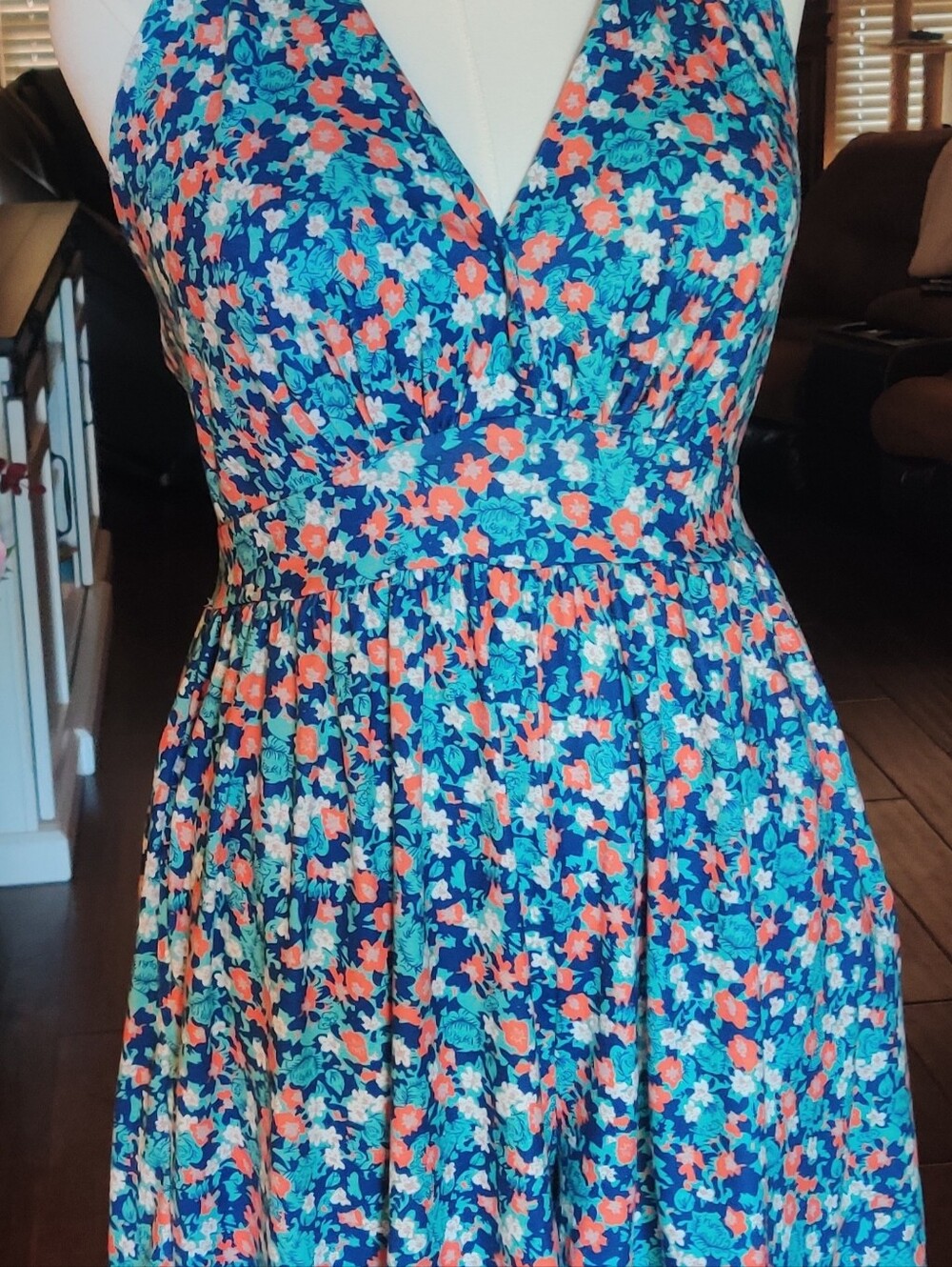 Blue and multi-color floral print halter jumper.